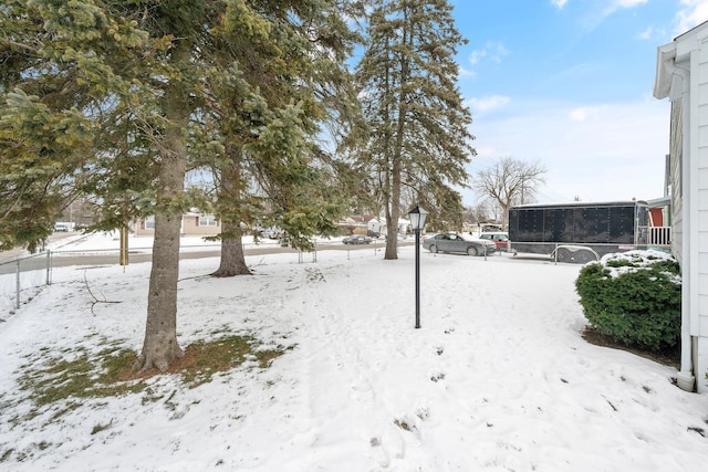 view of yard layered in snow