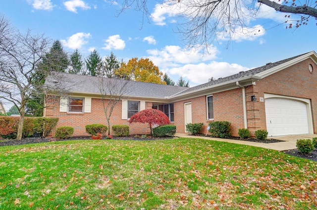 single story home with a front yard and a garage