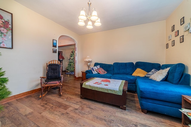 living room featuring a chandelier and hardwood / wood-style floors