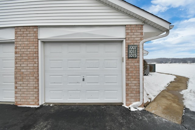 view of snow covered garage