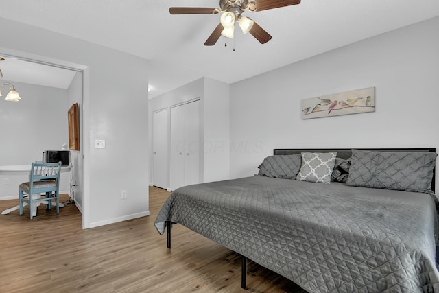 bedroom featuring ceiling fan, a closet, and wood-type flooring