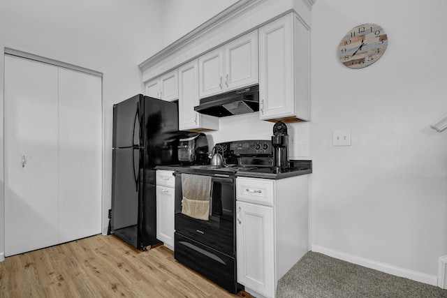 kitchen featuring black appliances, light hardwood / wood-style floors, and white cabinetry