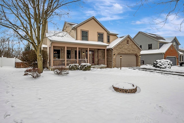 view of front property featuring a porch and a garage