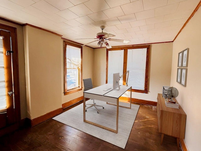 office area featuring ceiling fan, baseboards, ornamental molding, and hardwood / wood-style flooring