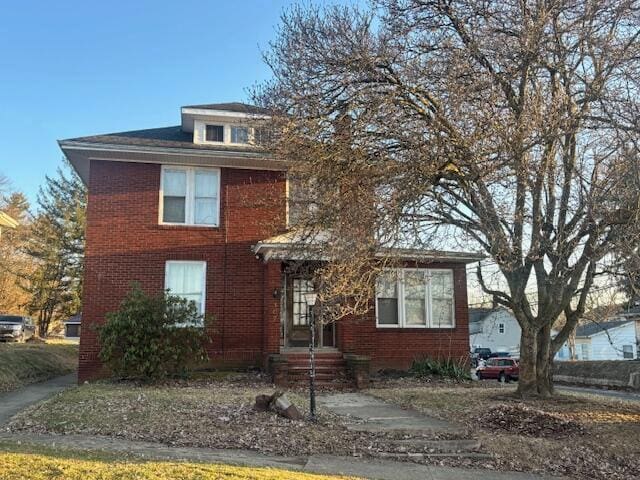 traditional style home with brick siding