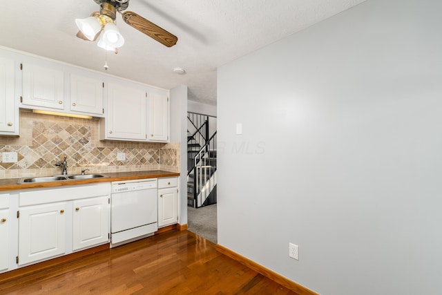 kitchen with white cabinetry, dishwasher, ceiling fan, sink, and dark hardwood / wood-style flooring