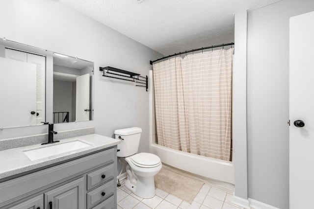 full bathroom with tile patterned flooring, vanity, a textured ceiling, and shower / bath combo with shower curtain