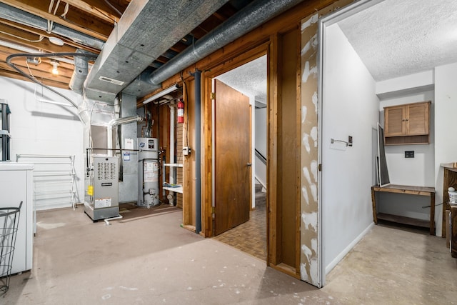 basement featuring gas water heater, a textured ceiling, washer / clothes dryer, and heating unit