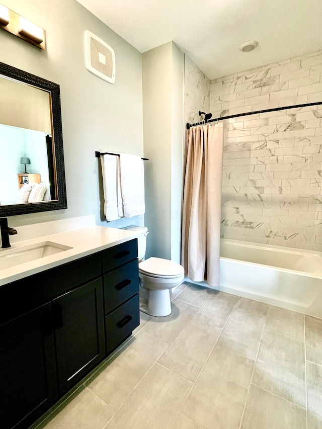 full bathroom with toilet, shower / tub combo, tile patterned floors, and vanity