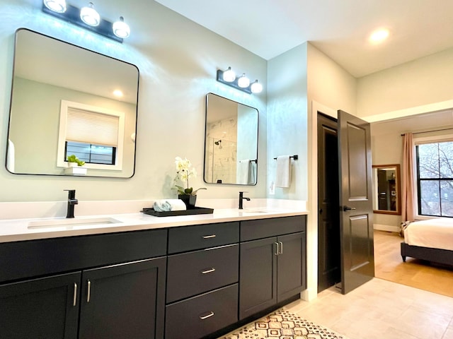 bathroom with tile patterned floors and vanity