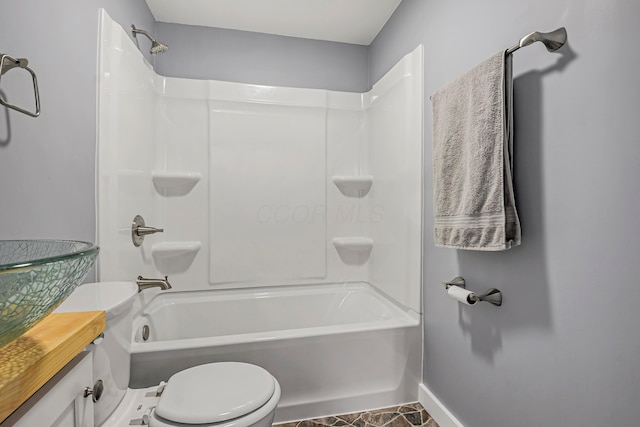 full bathroom featuring vanity, toilet, and washtub / shower combination