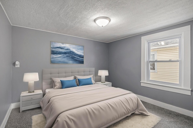 carpeted bedroom with a textured ceiling