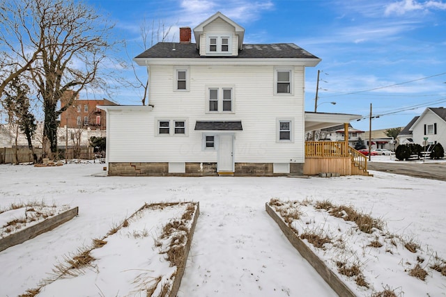 view of snow covered house