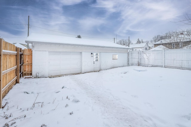 view of snow covered garage