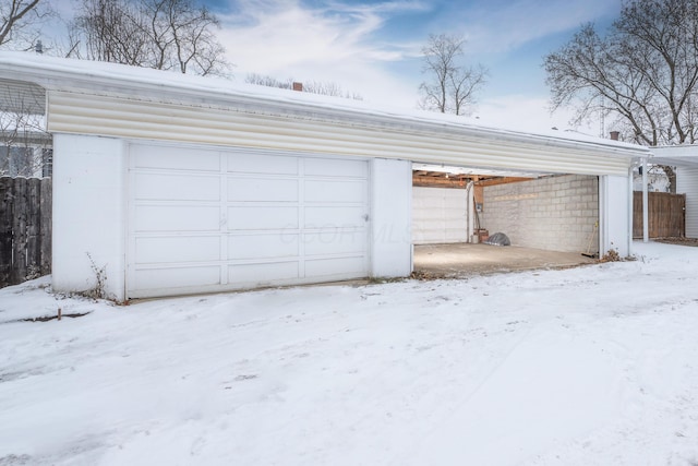 view of snow covered garage