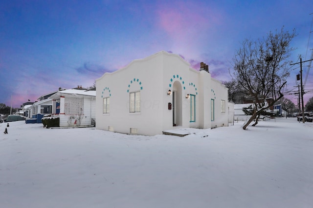 view of snow covered property