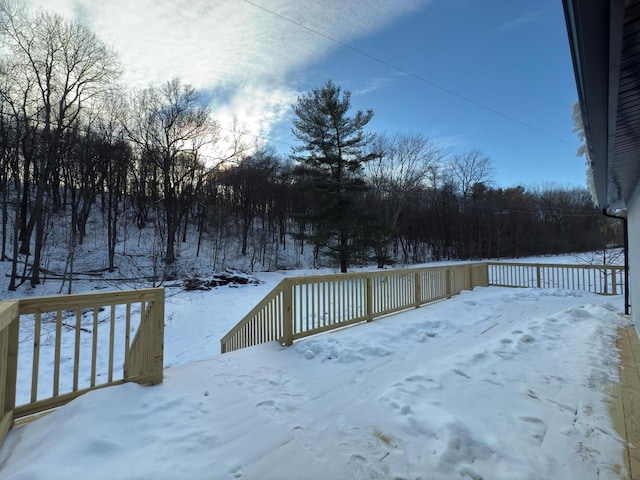 view of snow covered deck