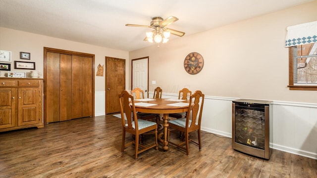 dining space with wine cooler, wood finished floors, and a ceiling fan