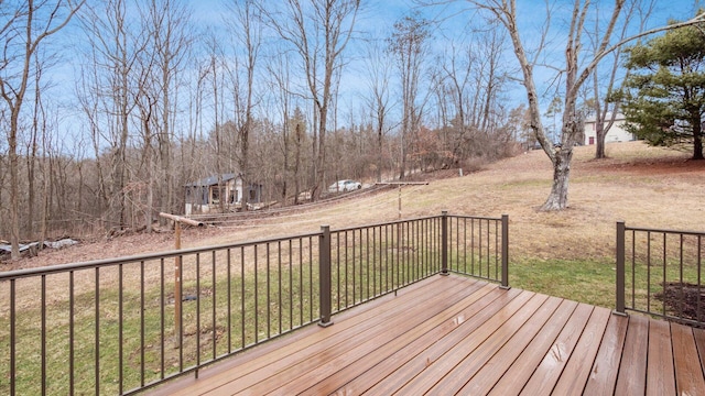 wooden deck featuring a yard