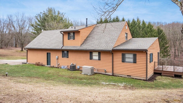 rear view of house featuring central air condition unit, a shingled roof, a yard, crawl space, and a wooden deck