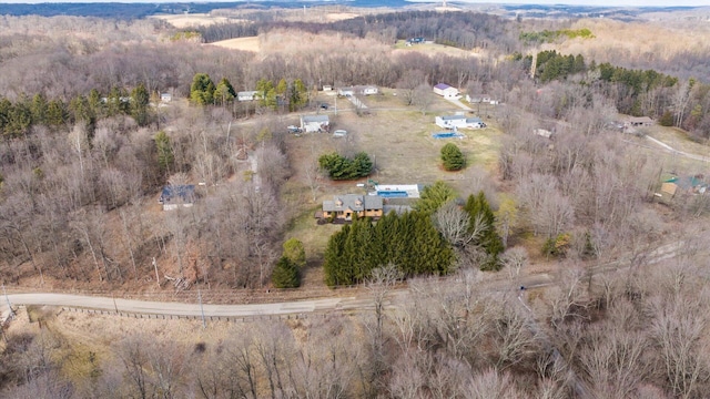 birds eye view of property with a rural view and a wooded view