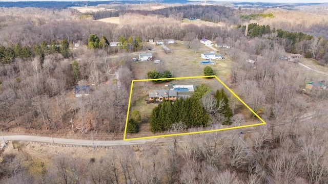 drone / aerial view with a forest view and a rural view