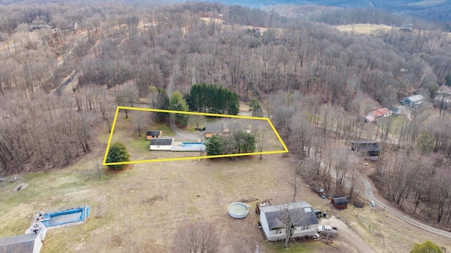 aerial view with a wooded view