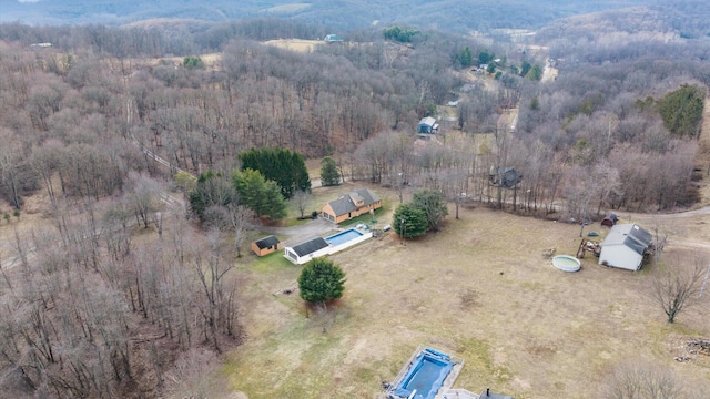 drone / aerial view featuring a forest view