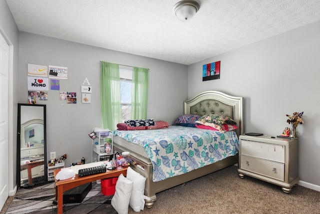 carpeted bedroom with a textured ceiling