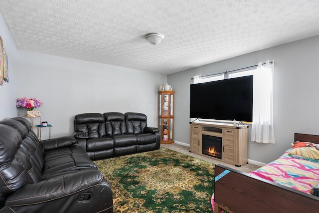 carpeted living room featuring a textured ceiling