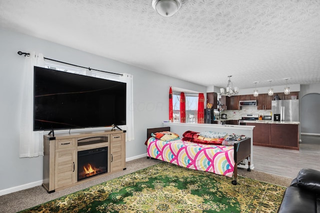 carpeted living room with a textured ceiling