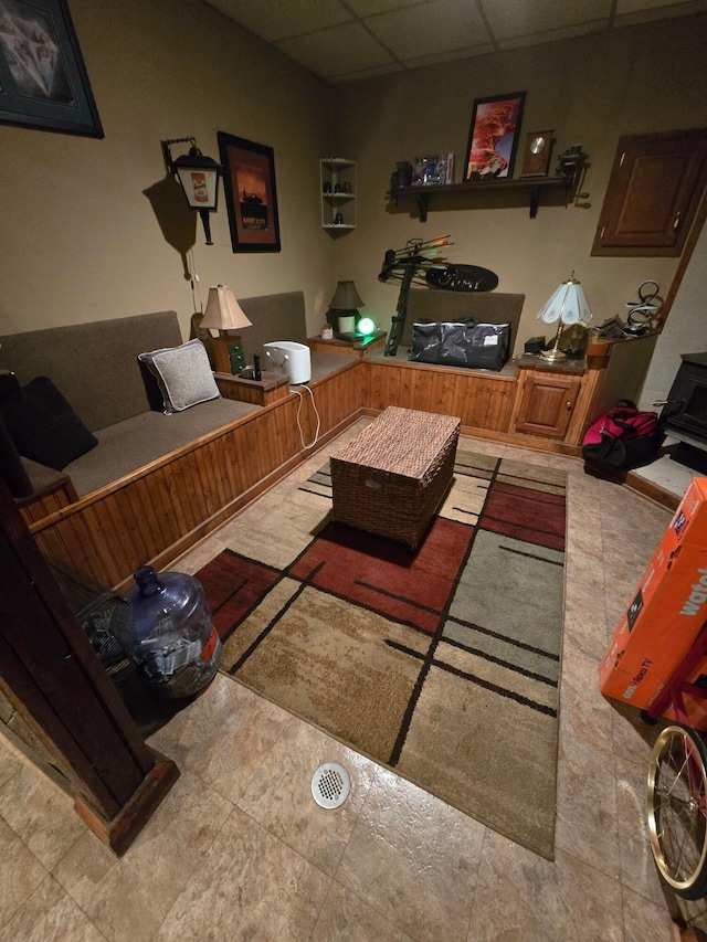 living room with a paneled ceiling