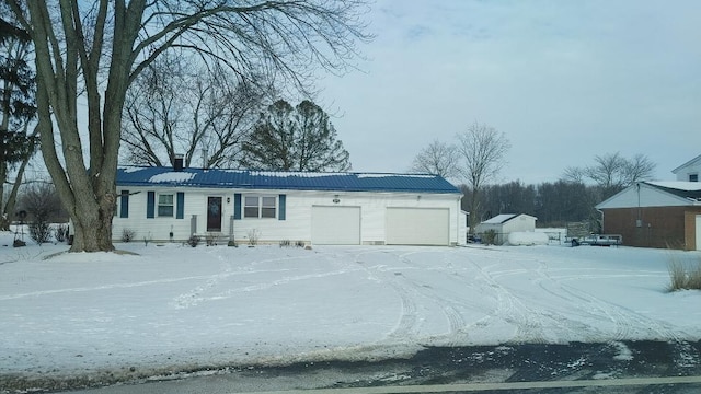 ranch-style home with a garage