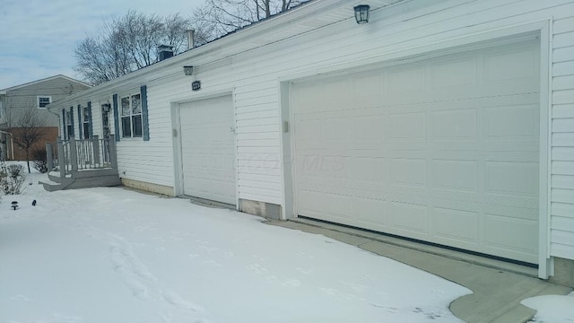 view of snow covered garage