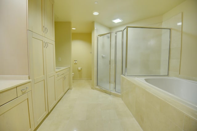 full bathroom with plus walk in shower, vanity, and toilet