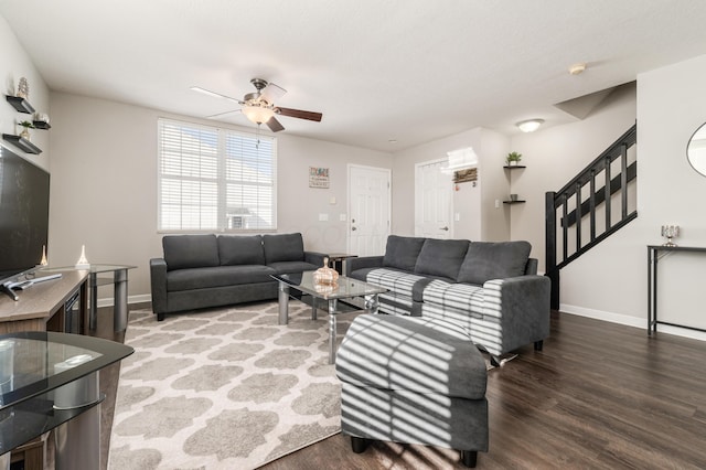 living room with dark hardwood / wood-style floors and ceiling fan