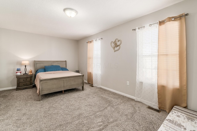 bedroom featuring light colored carpet