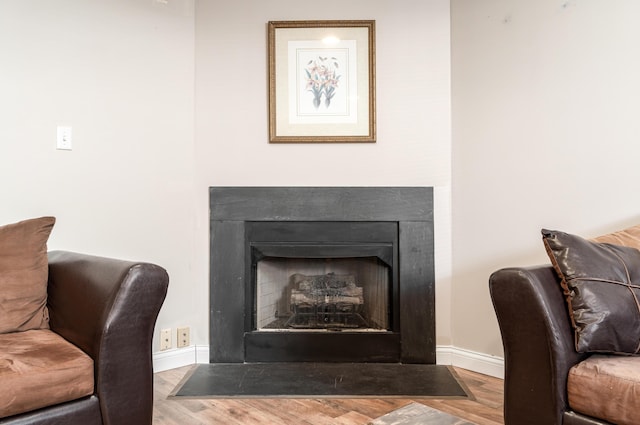 interior details featuring hardwood / wood-style flooring