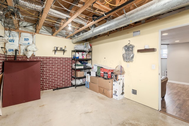 basement with brick wall