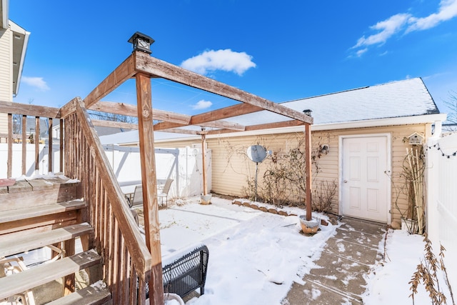 view of snow covered patio