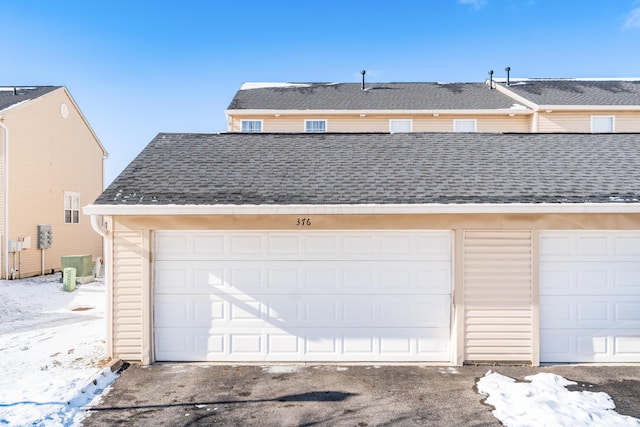 view of snow covered garage