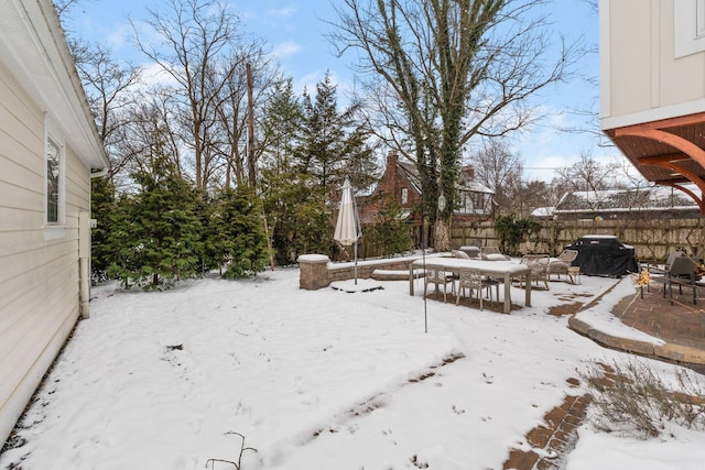 view of yard layered in snow