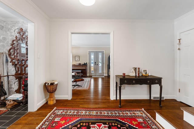 interior space featuring french doors, crown molding, and dark hardwood / wood-style floors