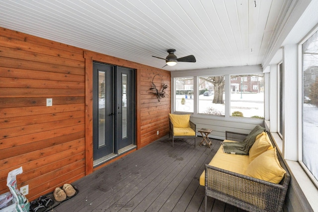 sunroom with ceiling fan and wood ceiling