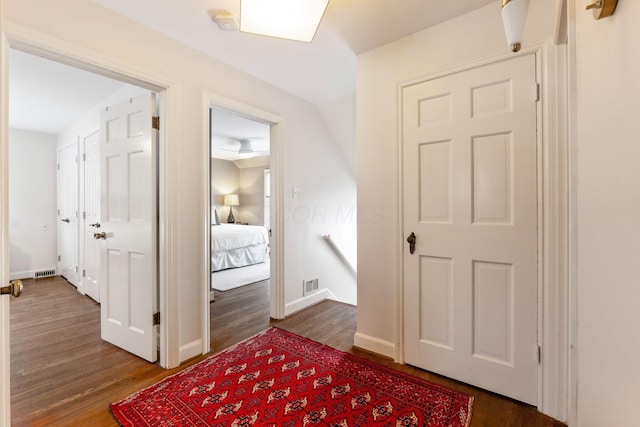 hallway featuring wood-type flooring