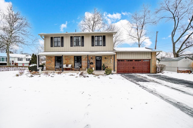 view of front of property with a porch and a garage