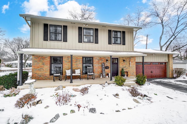 view of front of home with covered porch and a garage