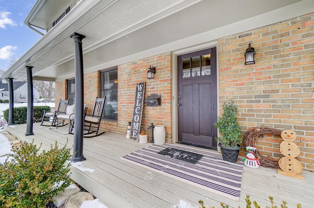 doorway to property featuring a porch