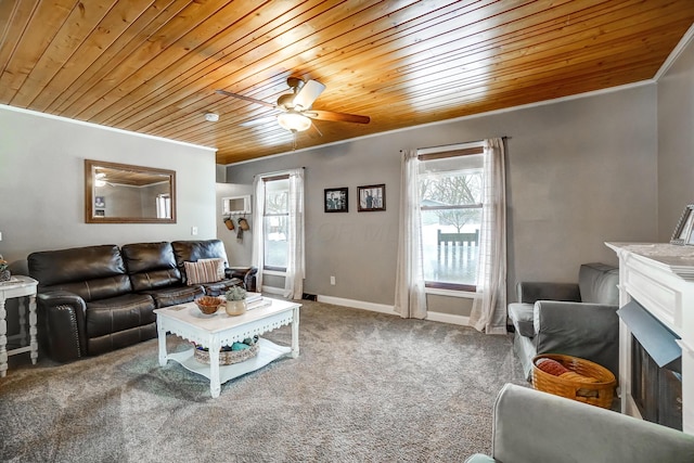 carpeted living room featuring ornamental molding, wood ceiling, and ceiling fan