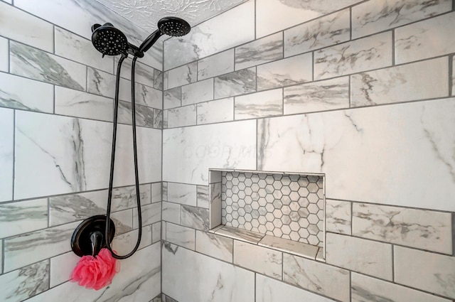 bathroom featuring tiled shower